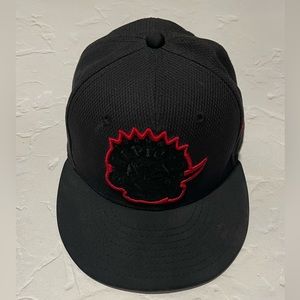 Used New Era Toronto Raptors fitted hat. 7 1/8. Retro logo patch.